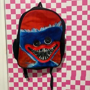 Source Unknown Red and Blue Monster Backpack